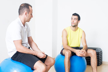 Man talking with coach during training