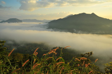 Fototapeta na wymiar Mountain Landscape Above the Clouds at Sunrise