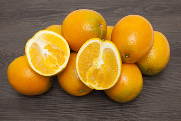 Fresh oranges  On wood background