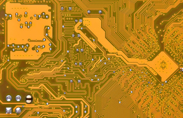 Close up of a printed orange computer circuit board