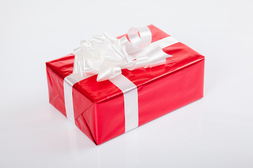 Red gift box with white bow for christmas