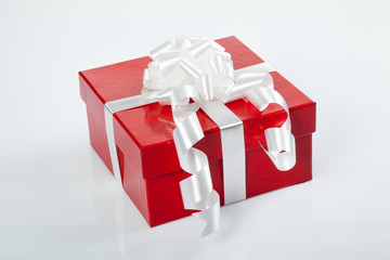 Red gift box with white bow for christmas