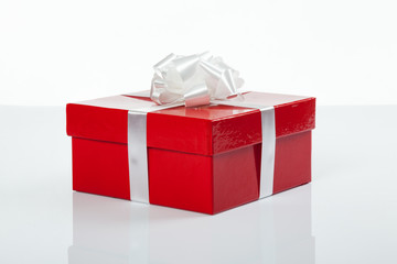 Red gift box with white bow for christmas