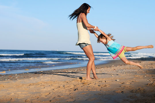 Child Swinging Parent Beach