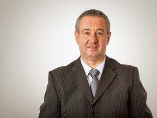 Portrait of elderly man in elegant suit