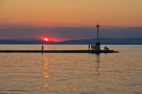 Lighthouse in Limenas harbour at sunset, island of Thassos