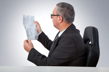 Man reading instruction manual on the desk