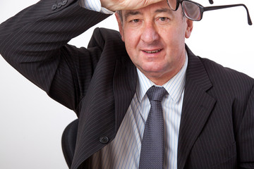 Man wipes satisfied with his hand over his forehead
