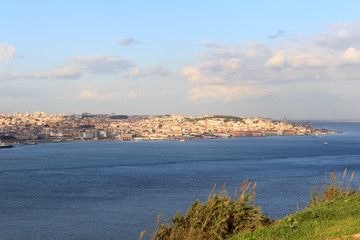 Fototapeta na wymiar View across river Tagus towards historic city of Lisbon