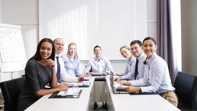 smiling business people meeting in office