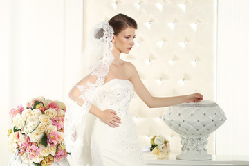 Gorgeous bride in a white room