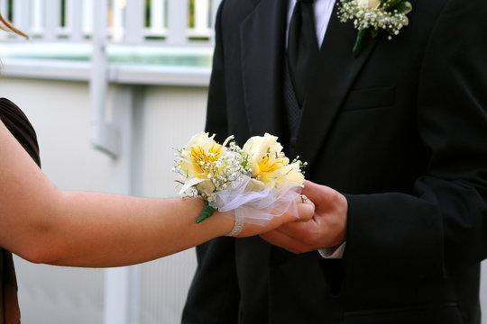 Hands Of Prom Couple With Corsage