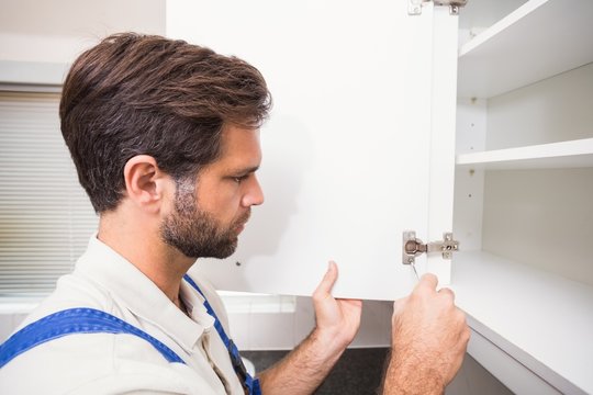 Handyman putting up a shelf