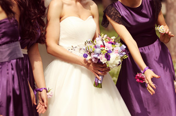 Detail and bride and bridesmaid with flowers