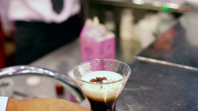 Barman making James Joice cocktail