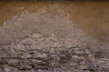 texture of rough half eroded sandstone wall