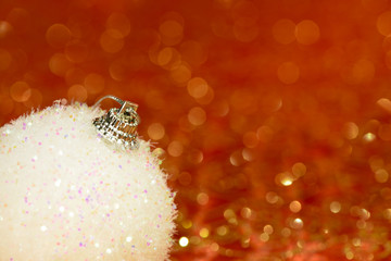 Christmas ornament  on orange shiny organza background