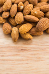 Almond on wooden background