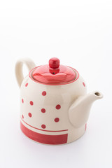 Polka dot tea pot isolated on white background