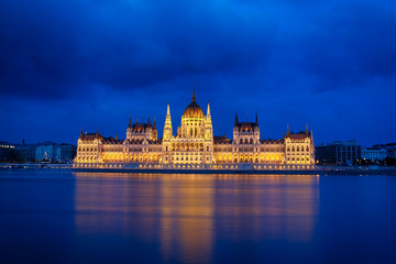 Fototapeta na wymiar Budapest Parliament at night with reflection in Danube river