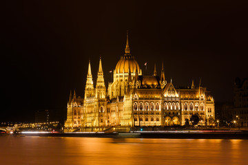 Fototapeta na wymiar Budapest Parliament at night with reflection in Danube river