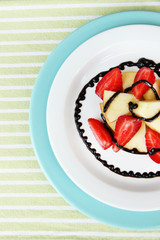 fresh tasty fruit salad on table