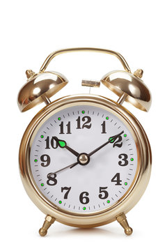 Big gold alarm clock on a white background