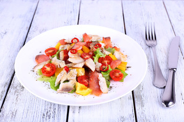 Fresh fish salad with vegetables