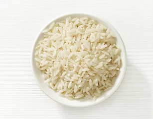 Deurstickers bowl of rice grains © Mara Zemgaliete