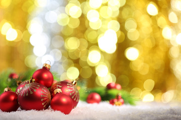Fototapeta na wymiar Christmas balls on abstract light background
