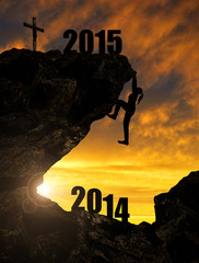 Silhouette girl climbs into the New Year 2015