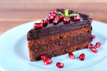 Delicious chocolate cake decorated with pomegranate seeds