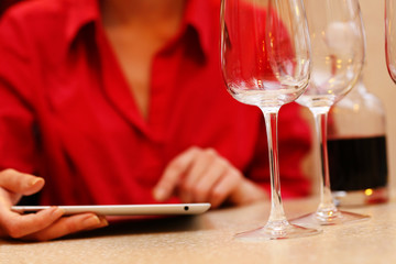 Woman with tablet computer in bar