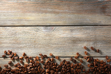 Coffee beans on wooden background