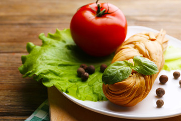 Smoked braided cheese on wooden table