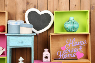 Beautiful colorful shelves with different home related objects