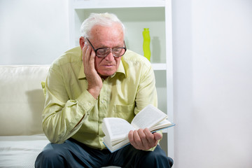 Senior Man Reading a Book
