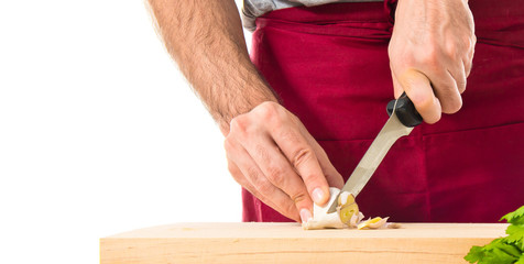 Chef cutting a garlic