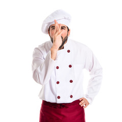 Chef making a joke over white background