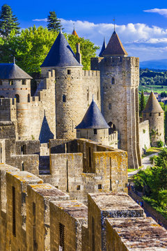 Carcassonne Medieval Fortress massive walls ramparts and  Stone Towers. France UNESCO Heritage Site. Largest Fortified Castle in Europe without People. Ancient Architecture . vertical orientation