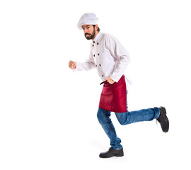 Chef running fast over white background