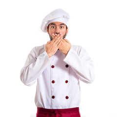 Chef doing surprise gesture over white background