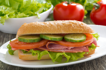 sandwich with ham and fresh vegetables