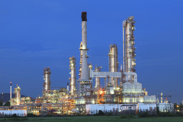 beautiful twilight time in evening of oil refinery plant in heav
