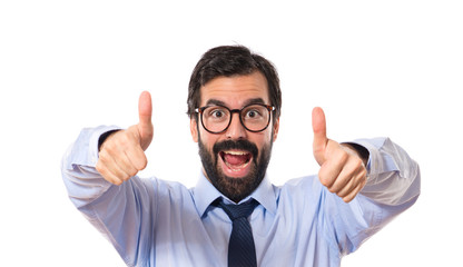 Businesssman with thumb up over white background