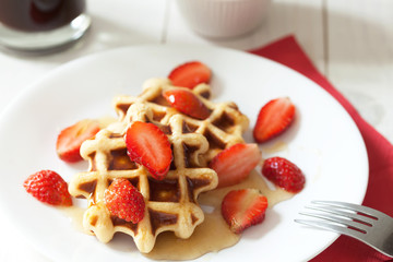 Waffles with honey and strawberry