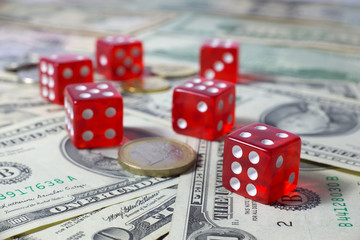 Six Red Dices on American Dollar Bills Background