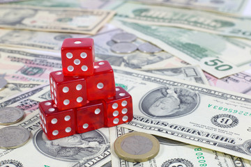 Six Red Dices Stacked on Top of Each Other on Money Background