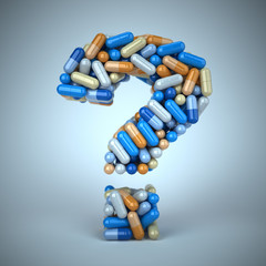 Pills or capsules as a question mark on blue background