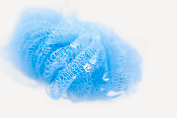 wet blue bath sponge with water drops